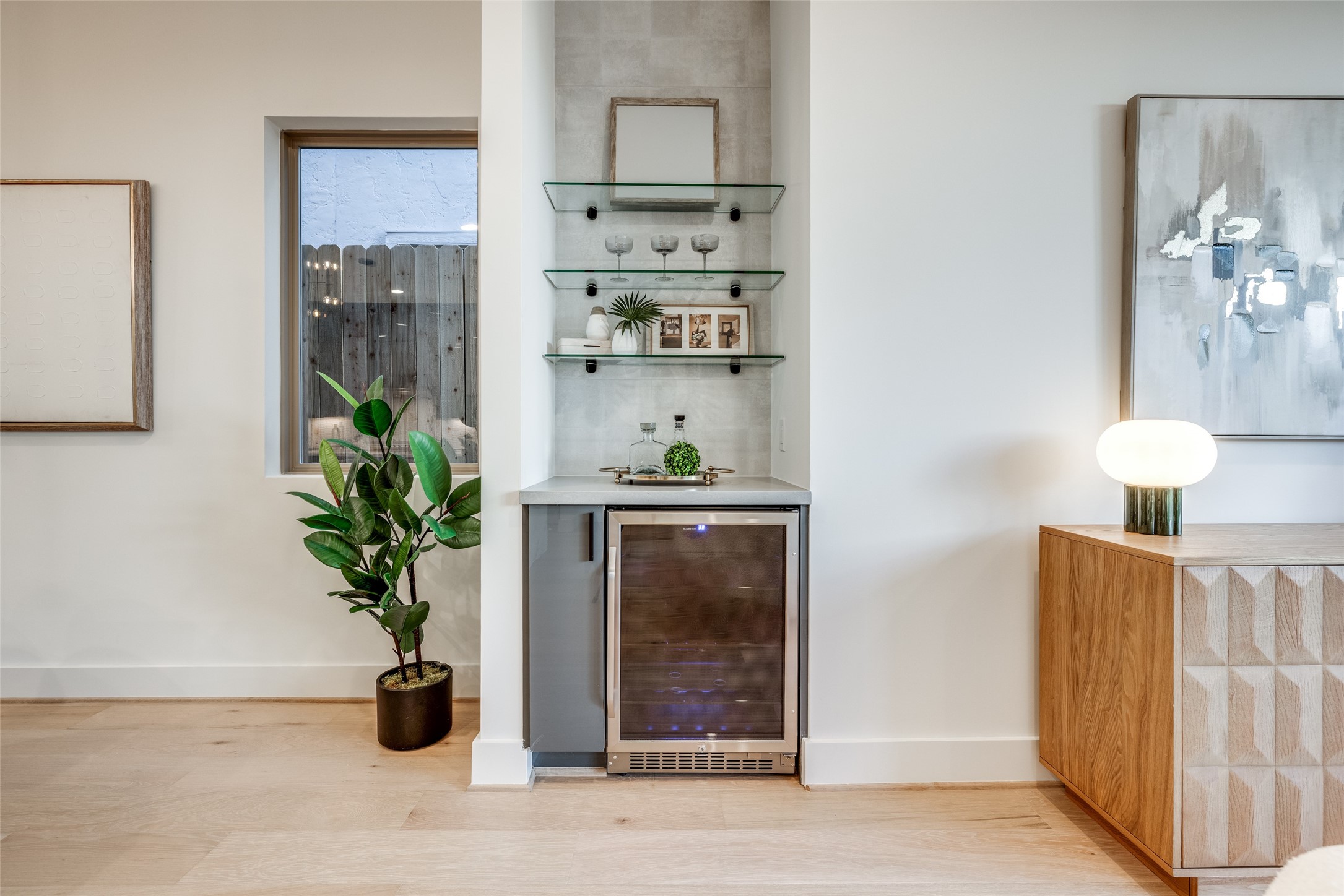 2630 Peckham Street Houston, TX 77098 - Photo 20 of 40 a view of a hallway with wooden floor and a potted plant