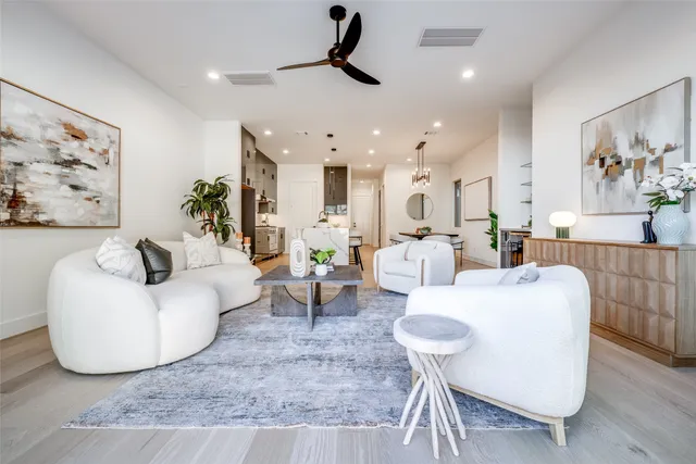 a spacious bedroom with a bed and a couch