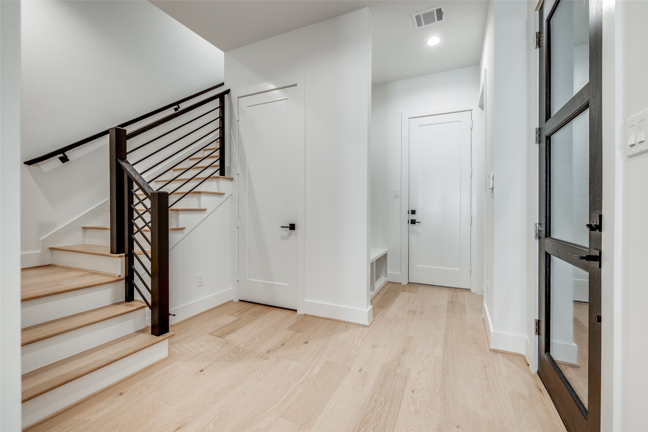 2630 Peckham Street Houston, TX 77098 - Photo 24 of 40 a view of a hallway with wooden floor and entryway