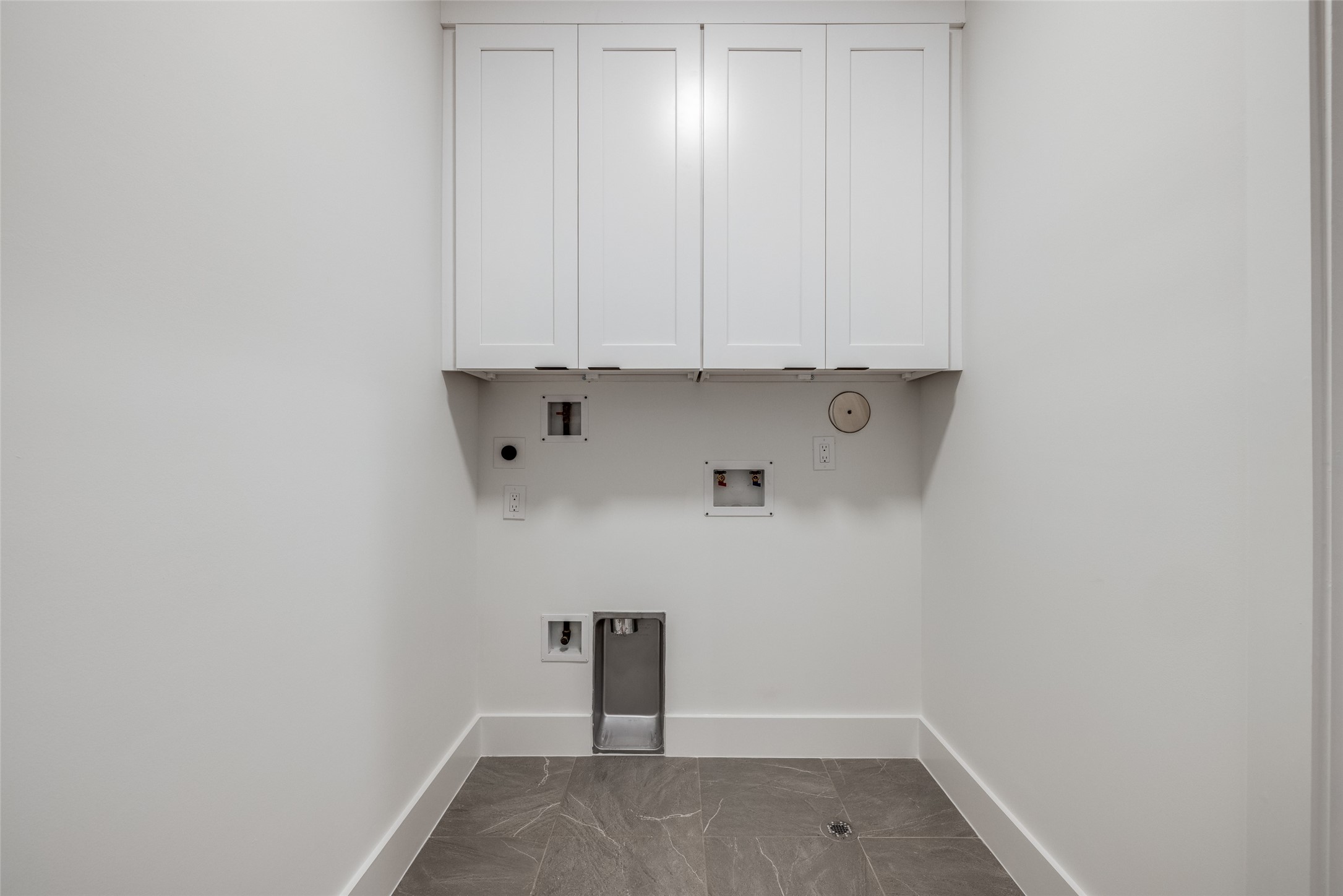 2630 Peckham Street Houston, TX 77098 - Photo 31 of 40 a view of storage and utility room with wooden floor