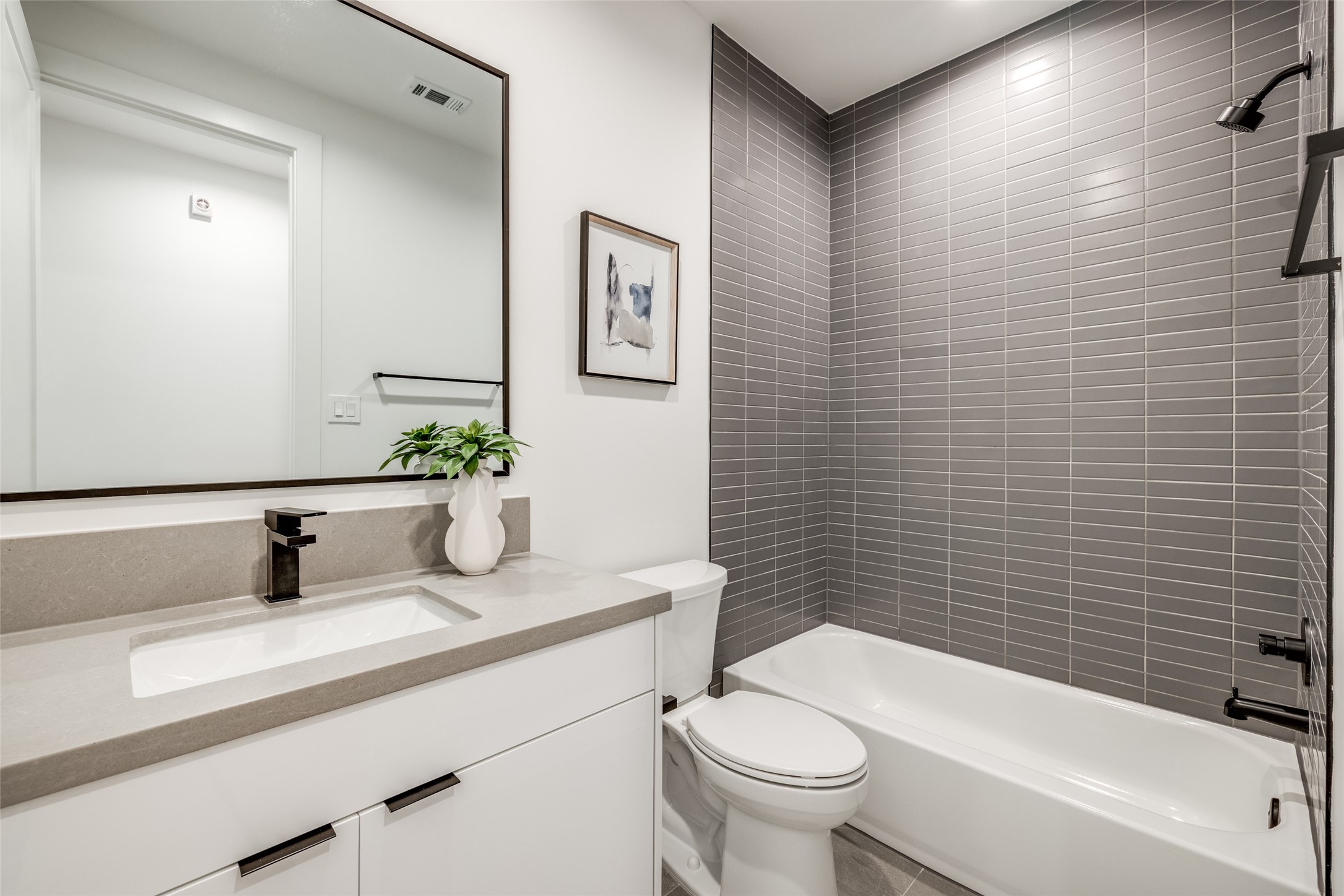 2630 Peckham Street Houston, TX 77098 - Photo 33 of 40 a bathroom with a sink a toilet and shower