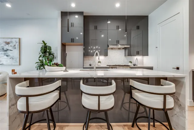 a kitchen with stainless steel appliances granite countertop a stove and a sink