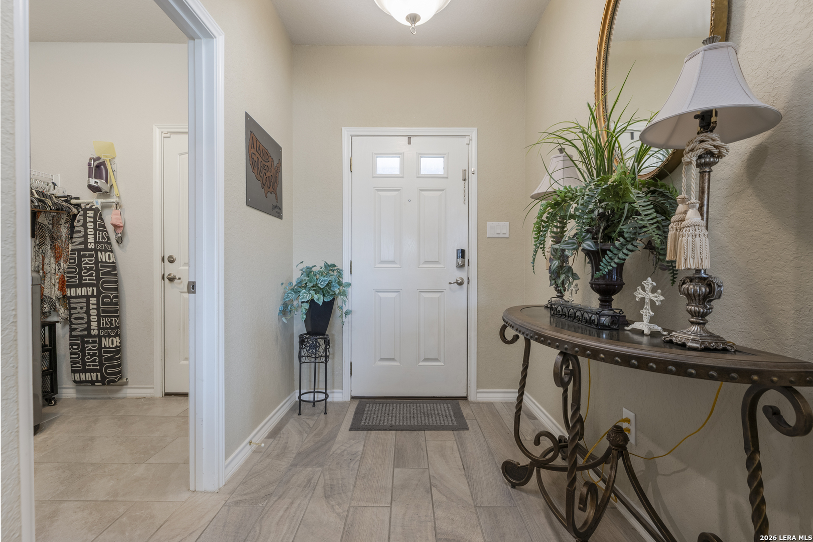 133 Grand View Floresville, TX 78114 - Photo 15 of 43 a view of a hallway with potted plant in front of it