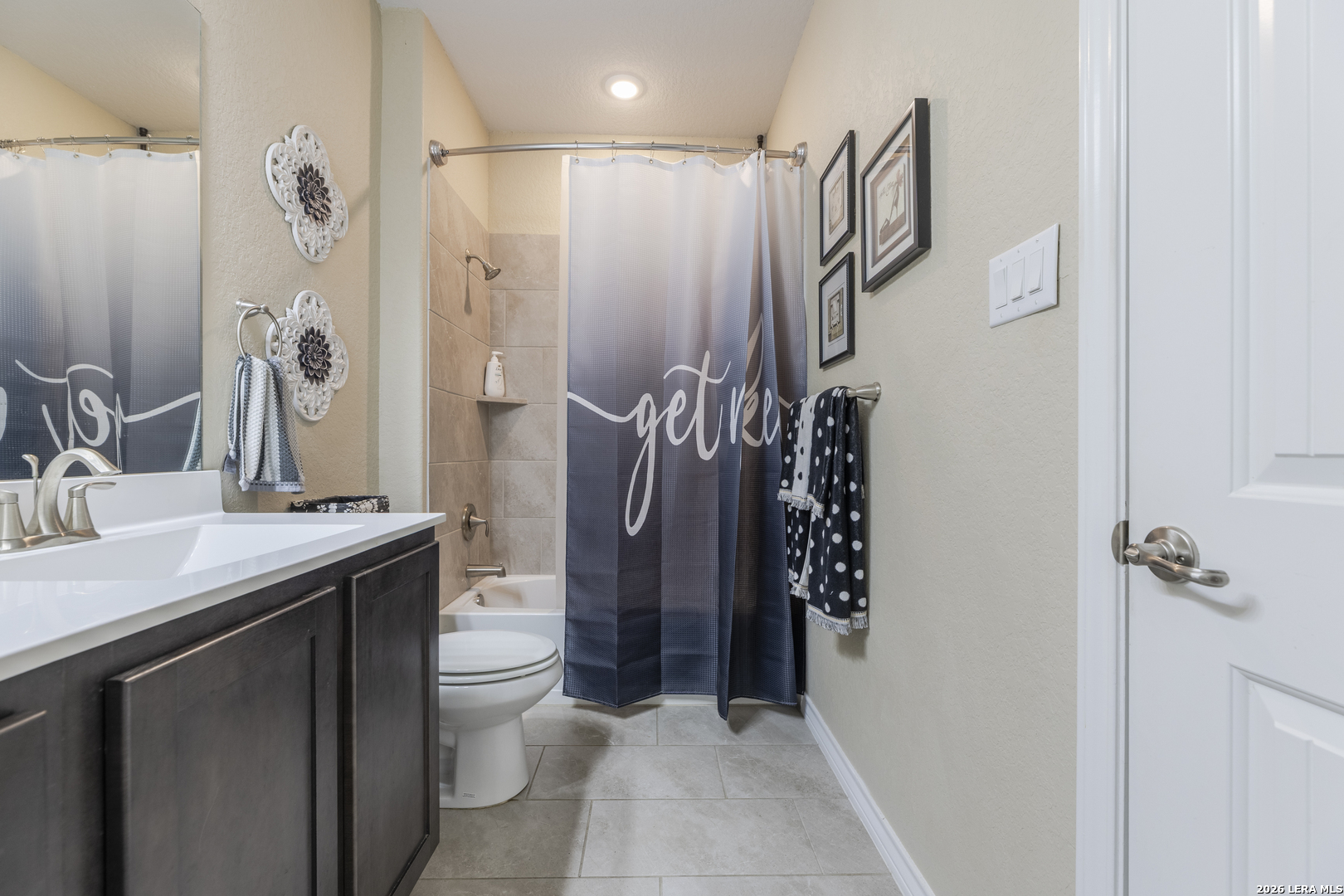 133 Grand View Floresville, TX 78114 - Photo 22 of 43 a bathroom with a sink a toilet and shower