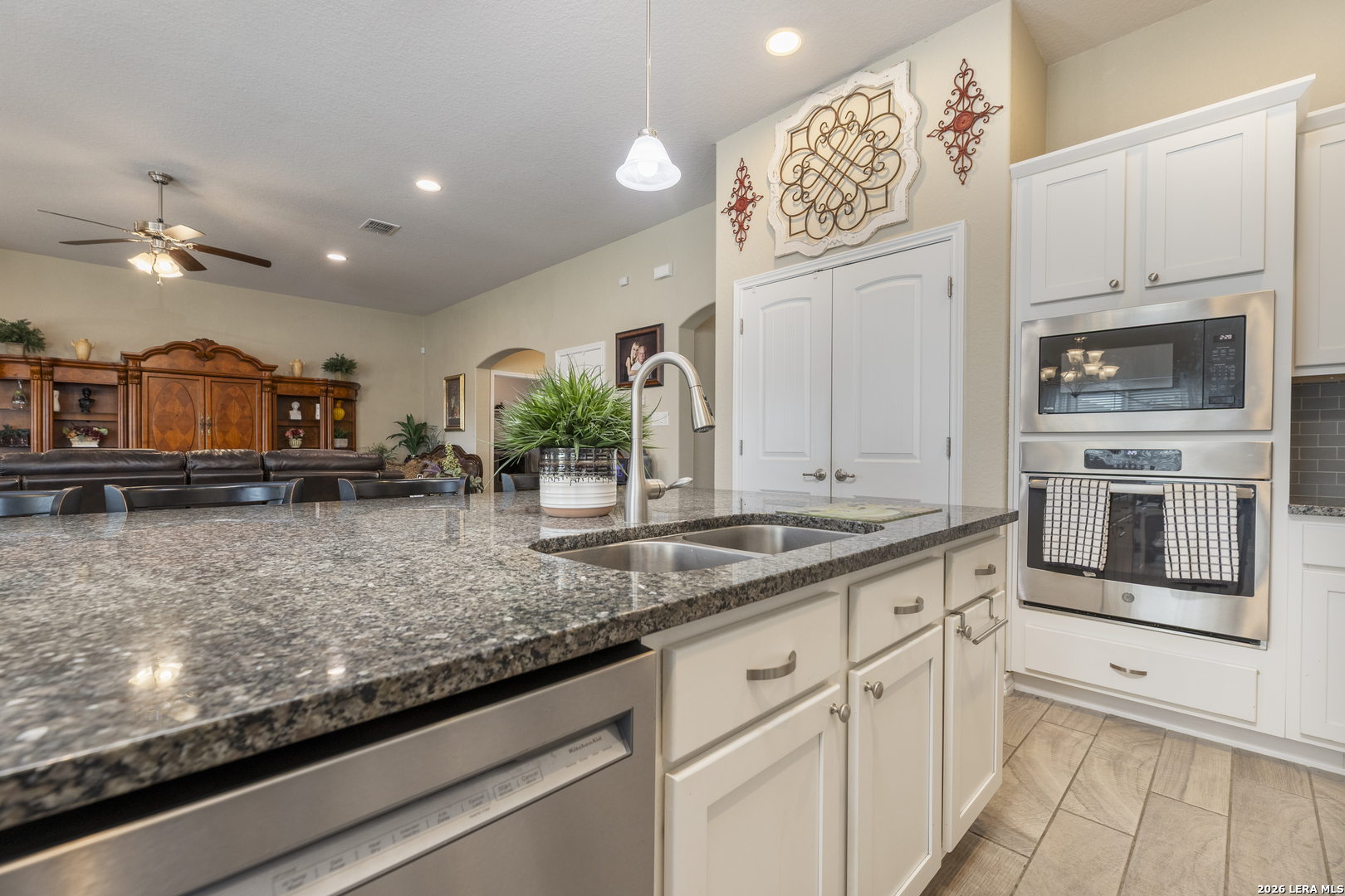 133 Grand View Floresville, TX 78114 - Photo 23 of 43 a kitchen with stainless steel appliances granite countertop a sink and cabinets