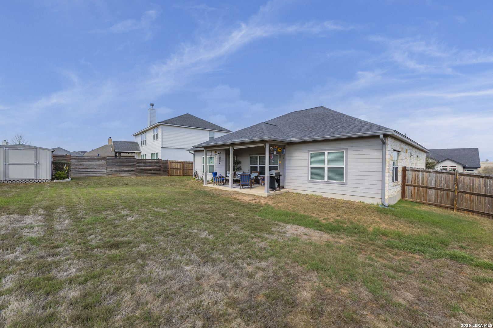 133 Grand View Floresville, TX 78114 - Photo 34 of 43 a view of a house with a yard and sitting area
