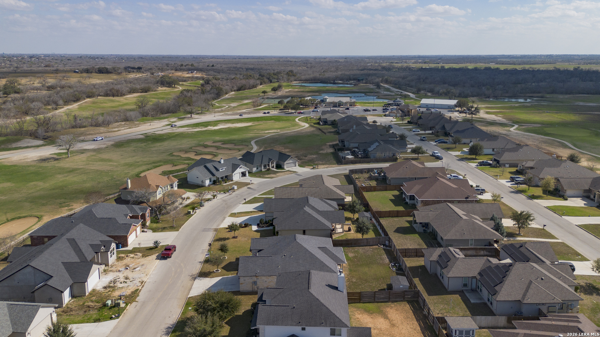 133 Grand View Floresville, TX 78114 - Photo 39 of 43 an aerial view of residential houses with outdoor space