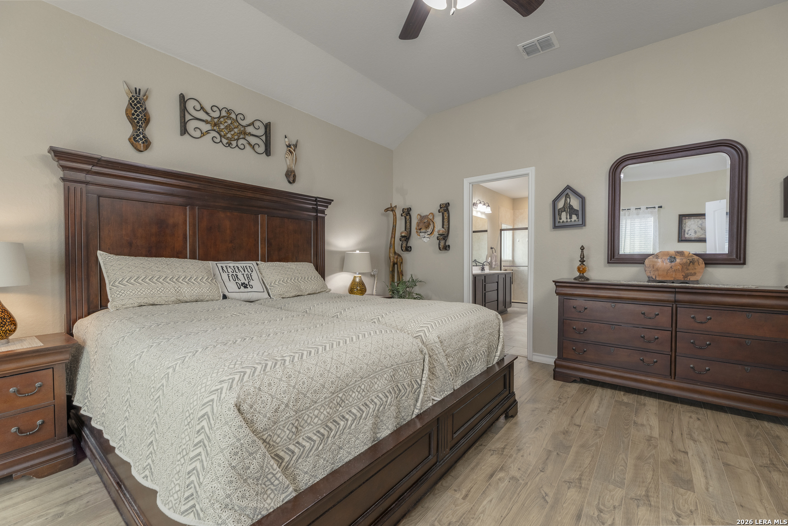 133 Grand View Floresville, TX 78114 - Photo 10 of 43 a bedroom with a bed and a dresser