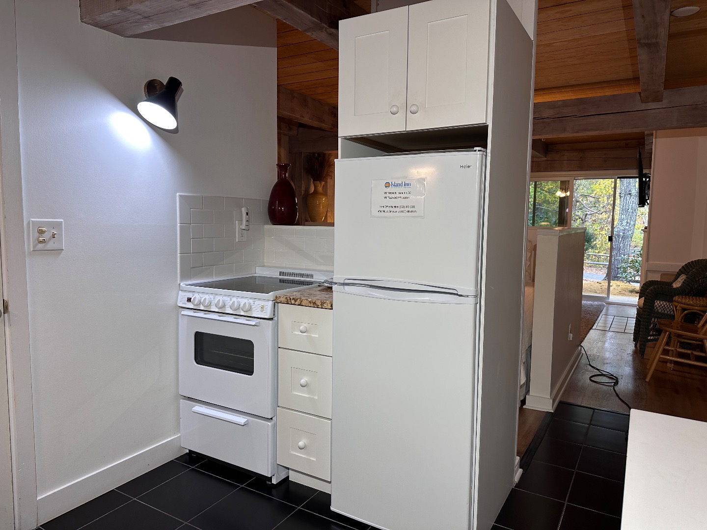 21 Island Inn Road, Unit 39G Oak Bluffs, MA 02557 - Photo 16 of 31 a kitchen with white cabinets and white appliances