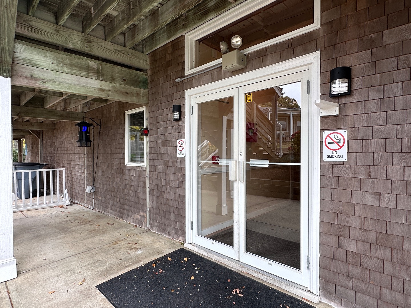 21 Island Inn Road, Unit 39G Oak Bluffs, MA 02557 - Photo 25 of 31 a view of a brick house with a glass door
