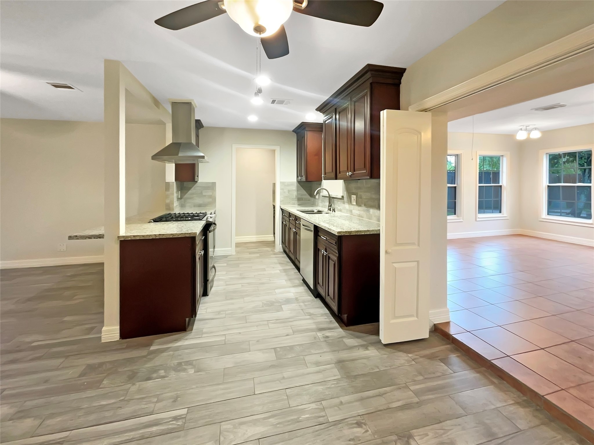 12107 Pompton Drive Houston, TX 77089 - Photo 11 of 23 a large kitchen with stainless steel appliances granite countertop a stove and a refrigerator