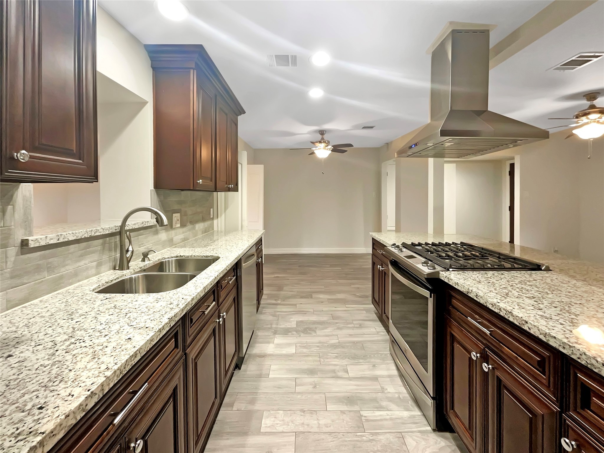 12107 Pompton Drive Houston, TX 77089 - Photo 14 of 23 a kitchen with stainless steel appliances granite countertop a sink and stove