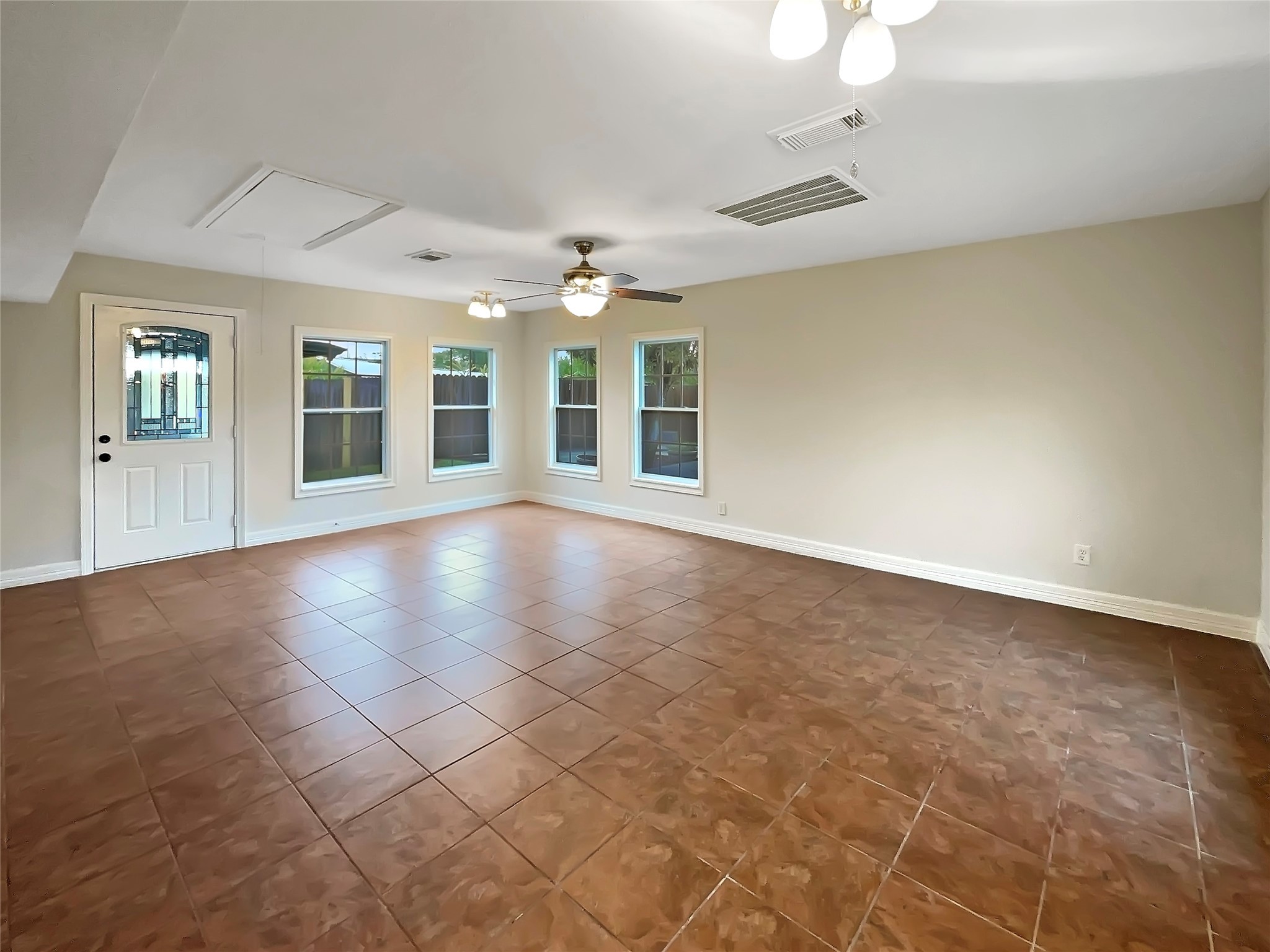 12107 Pompton Drive Houston, TX 77089 - Photo 15 of 23 an empty room with windows and entrance