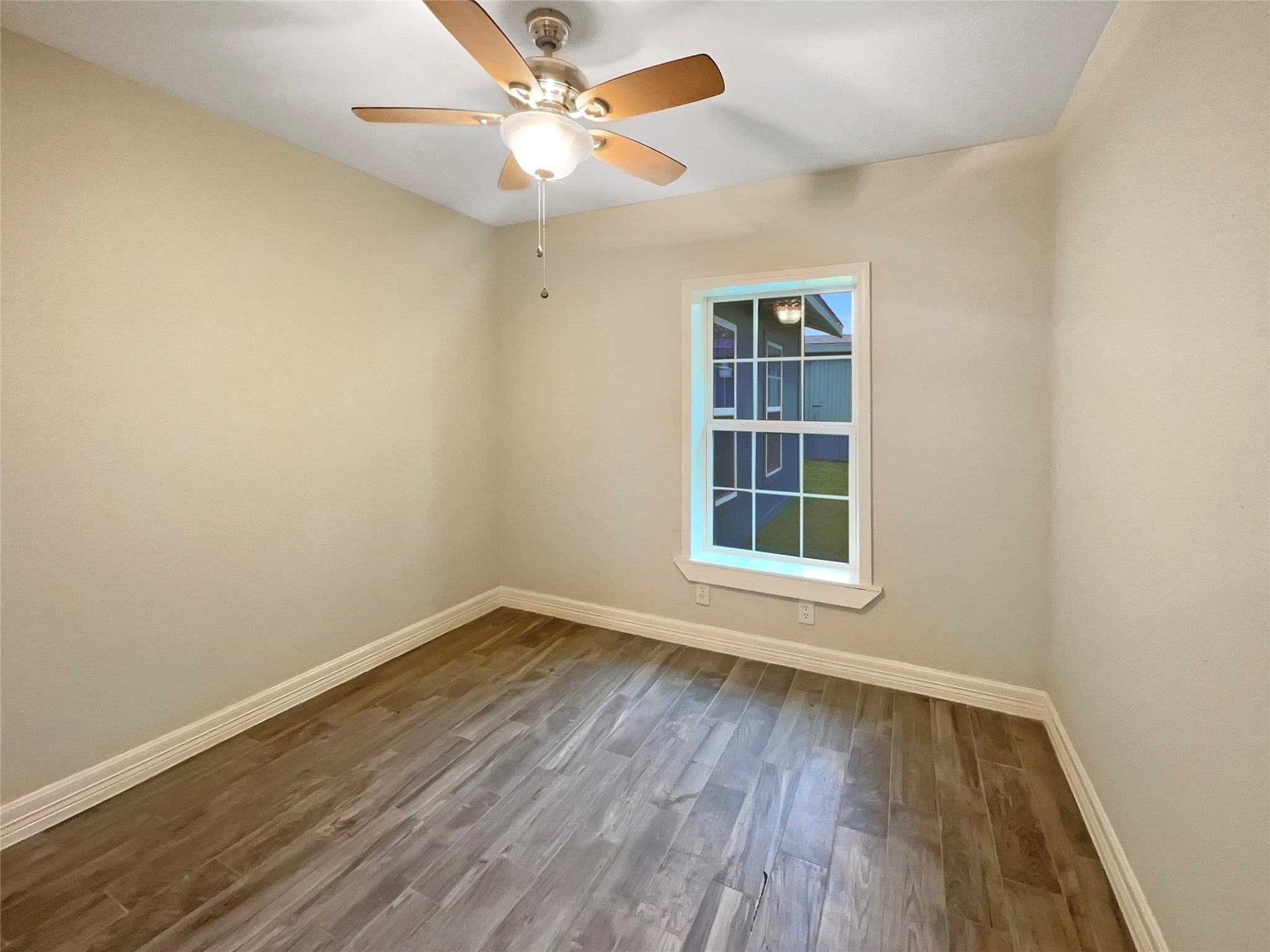 12107 Pompton Drive Houston, TX 77089 - Photo 16 of 23 wooden floor in an empty room with a window