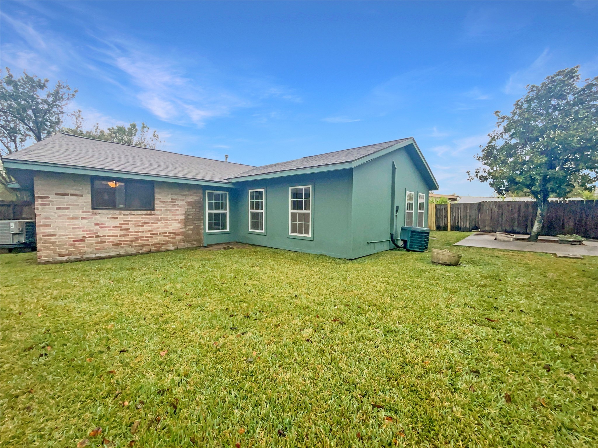12107 Pompton Drive Houston, TX 77089 - Photo 22 of 23 a front view of house with yard and trees