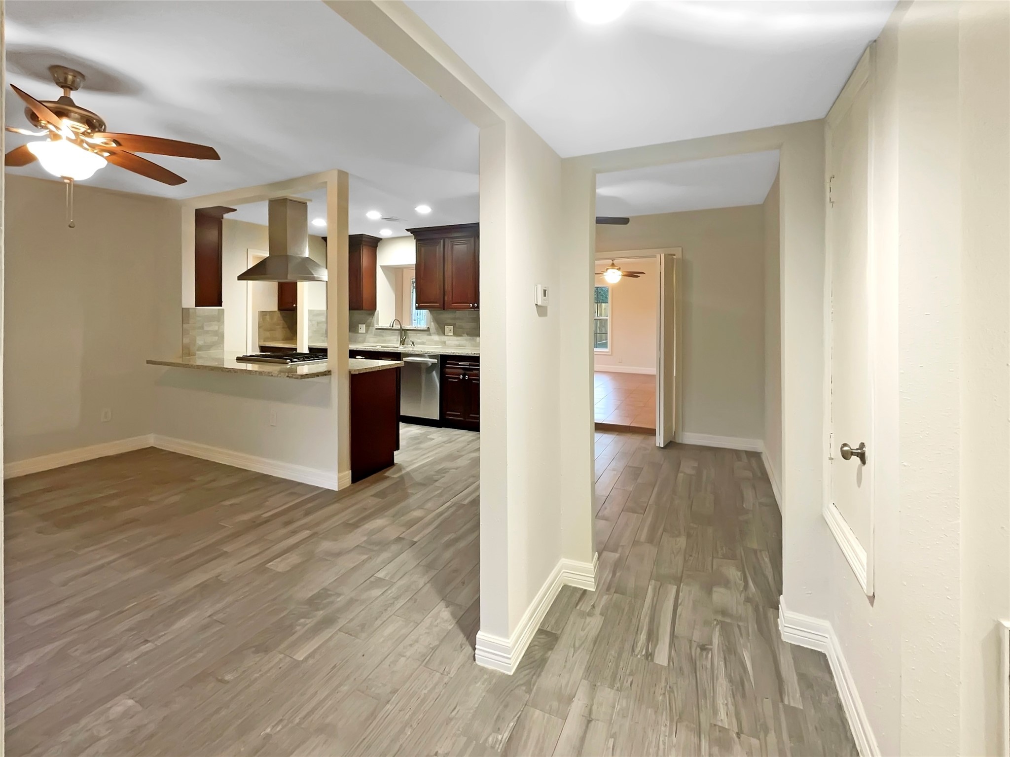 12107 Pompton Drive Houston, TX 77089 - Photo 9 of 23 a view of a kitchen cabinets and wooden floor