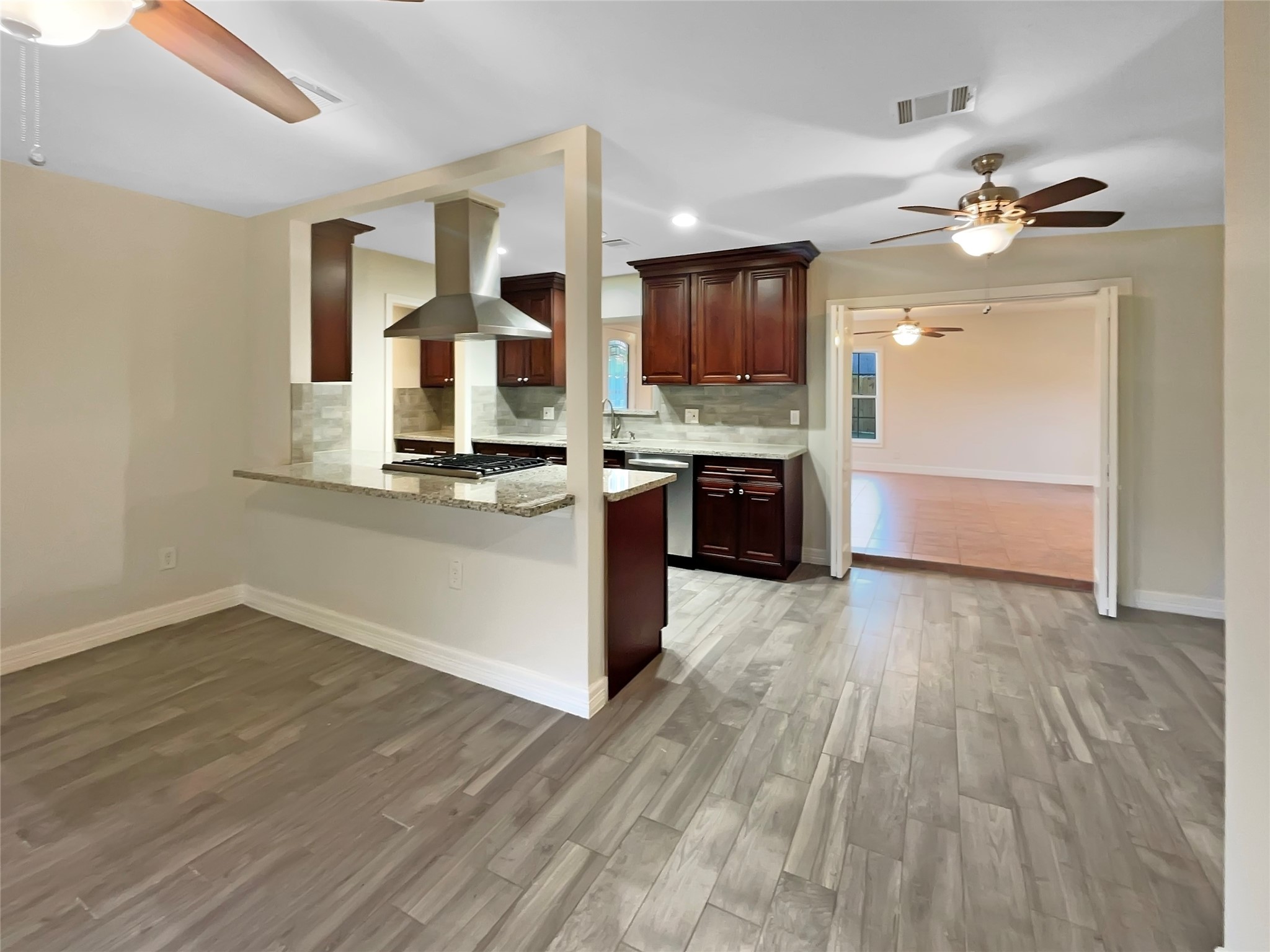 12107 Pompton Drive Houston, TX 77089 - Photo 10 of 23 a kitchen with stainless steel appliances granite countertop a stove and a sink