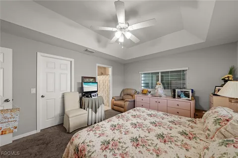 a bedroom with a bed and a couch