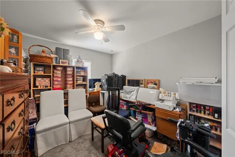 a living room with a couch and a bookshelf