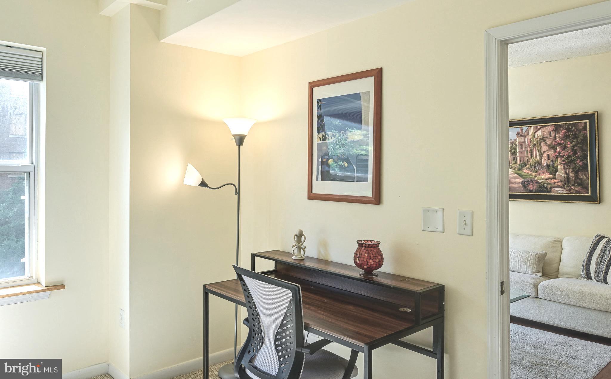 1111 11th Street Northwest, Unit 304 Washington, DC 20001 - Photo 17 of 27 a view of a workspace with furniture and a potted plant