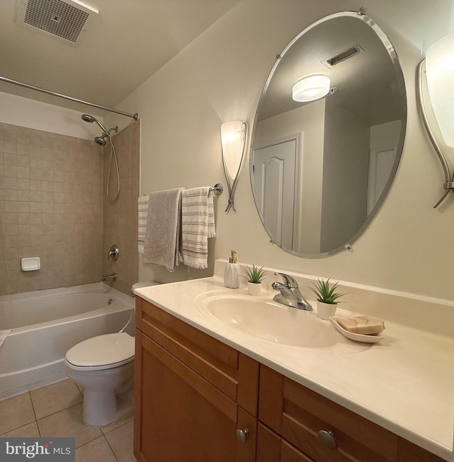 1111 11th Street Northwest, Unit 304 Washington, DC 20001 - Photo 18 of 27 a bathroom with a sink a toilet and shower