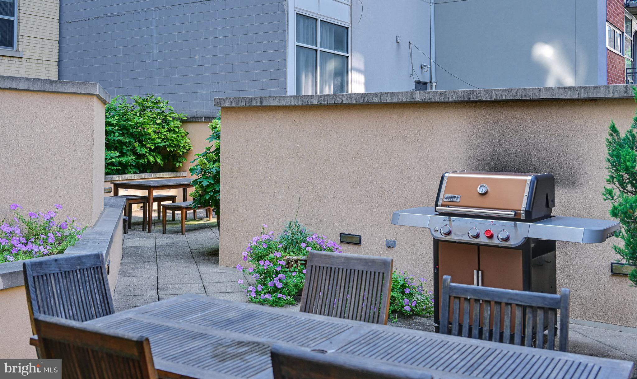 1111 11th Street Northwest, Unit 304 Washington, DC 20001 - Photo 24 of 27 a view of a house with backyard and sitting area