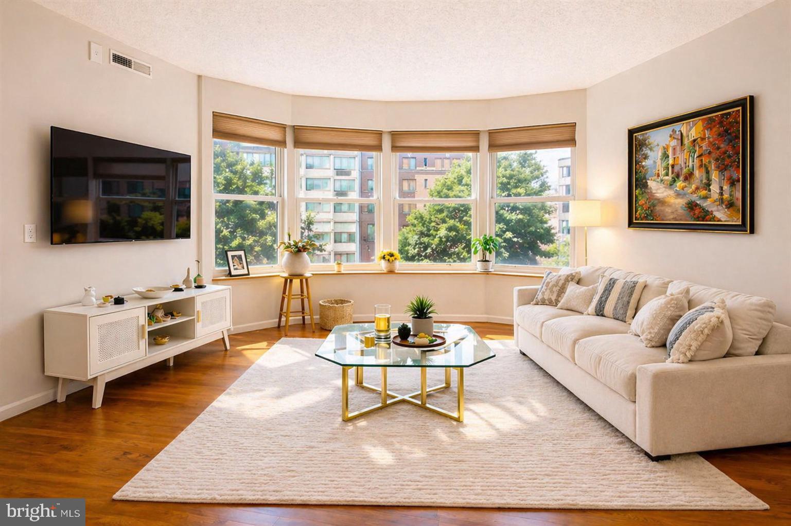 1111 11th Street Northwest, Unit 304 Washington, DC 20001 - Photo 3 of 25 Sunlit living space with urban views.