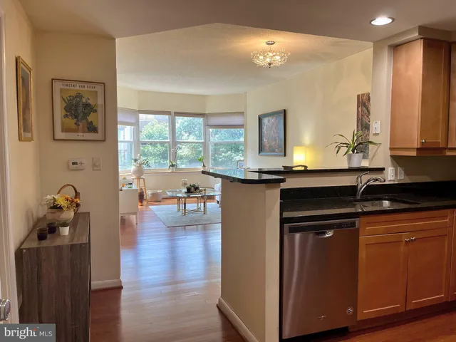 a kitchen with a sink cabinets and window