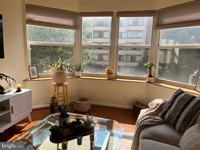 a room with furniture and a large window