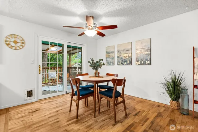 a view of a dining room with furniture window and wooden floor