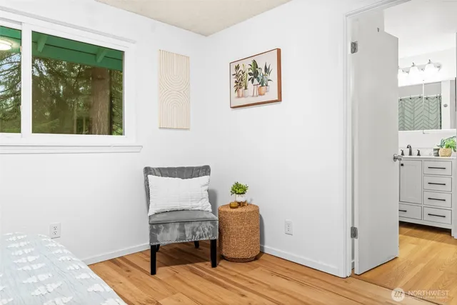 a view of workspace with wooden floor and window