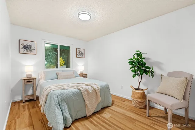 a bedroom with a bed and a chair