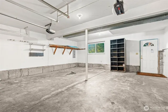 a view of an empty room with a garage
