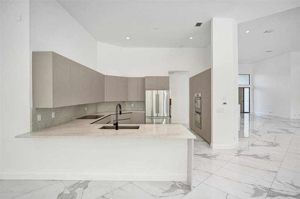 4701 Pine Tree Drive Boynton Beach, FL 33436 - Photo 17 of 76 a room with gym equipment and mirrors