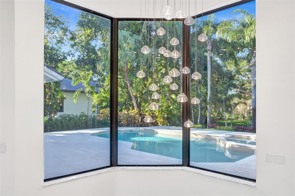 4701 Pine Tree Drive Boynton Beach, FL 33436 - Photo 23 of 76 a view of backyard from a window