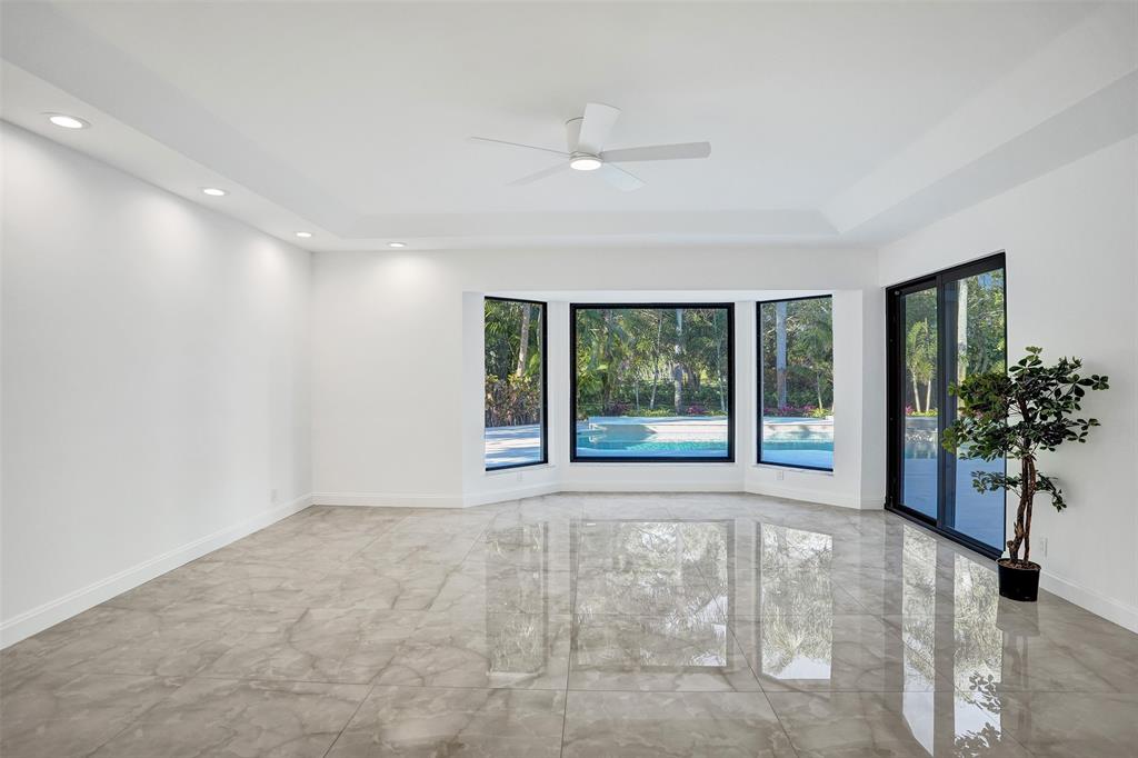 4701 Pine Tree Drive Boynton Beach, FL 33436 - Photo 27 of 76 a view of an empty room with a window