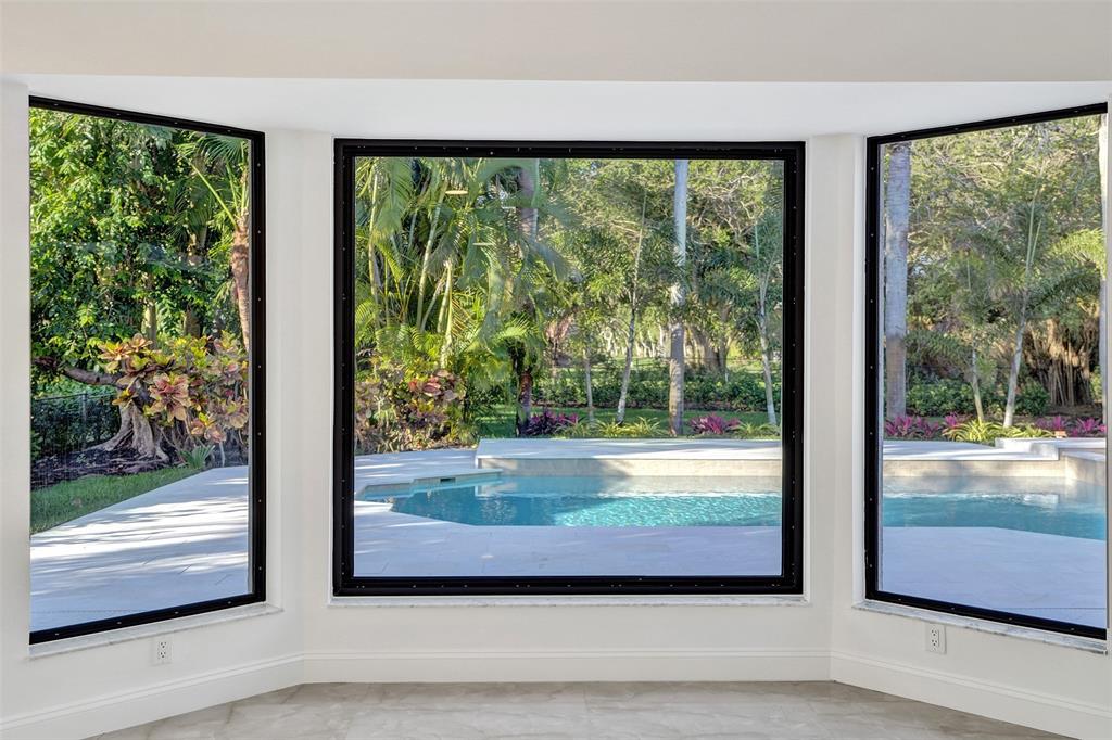 4701 Pine Tree Drive Boynton Beach, FL 33436 - Photo 30 of 76 a view of a porch