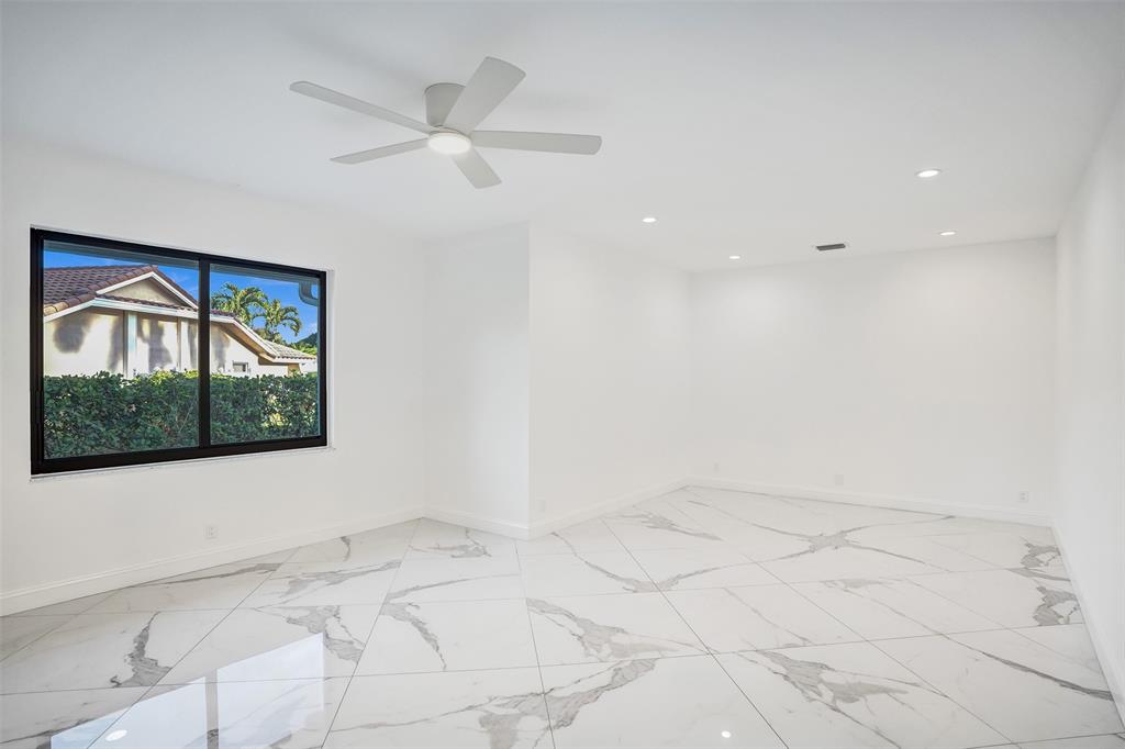 4701 Pine Tree Drive Boynton Beach, FL 33436 - Photo 38 of 76 a view of an empty room with a window