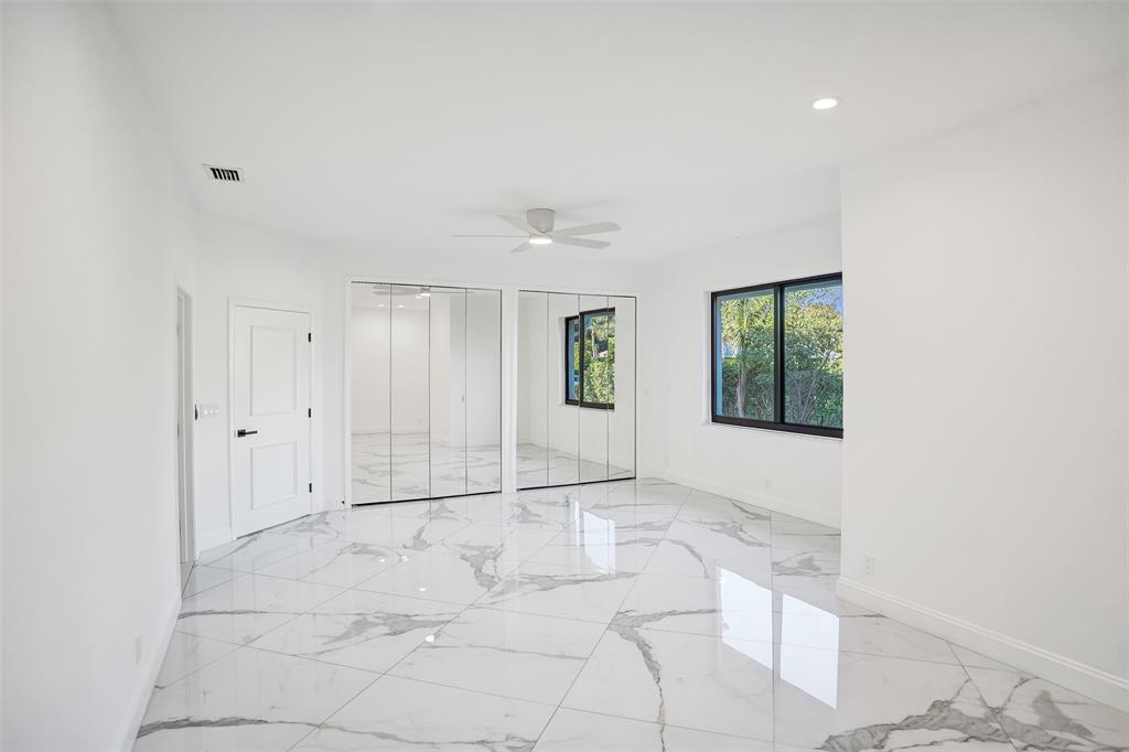 4701 Pine Tree Drive Boynton Beach, FL 33436 - Photo 39 of 76 a view of an empty room with a window