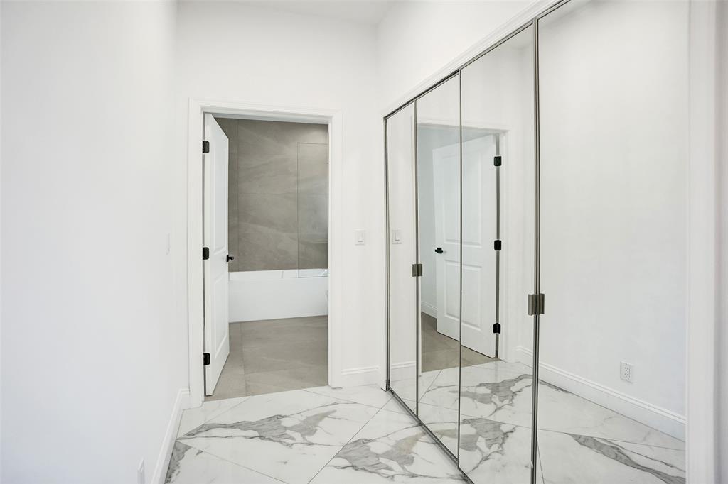 4701 Pine Tree Drive Boynton Beach, FL 33436 - Photo 44 of 76 a bathroom with a shower and closet