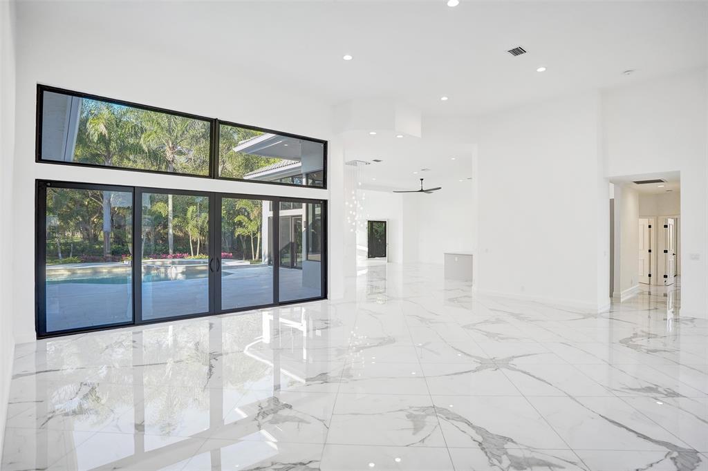 4701 Pine Tree Drive Boynton Beach, FL 33436 - Photo 7 of 76 a view of empty room with floor to ceiling windows