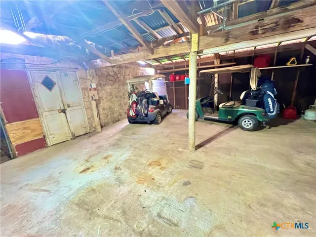 a view of a garage with storage