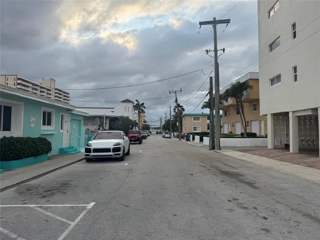 a view of ocean with a palm tree