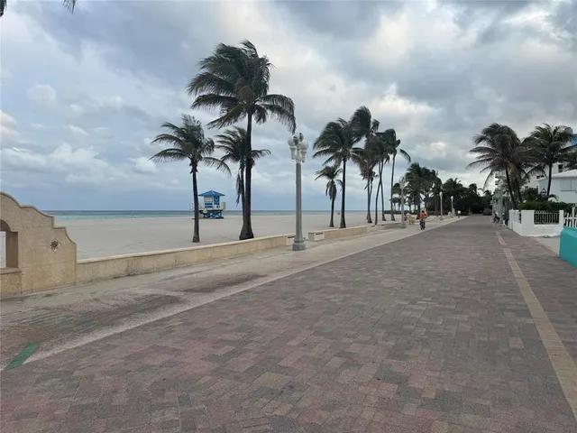 a kitchen with a sink cabinets and a window
