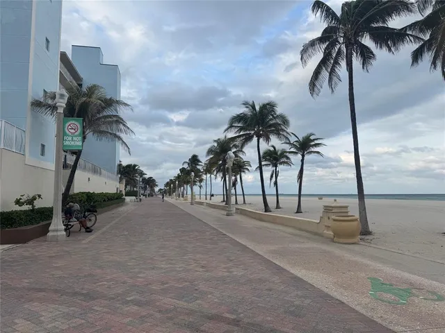 a kitchen with stainless steel appliances granite countertop a stove microwave and cabinets