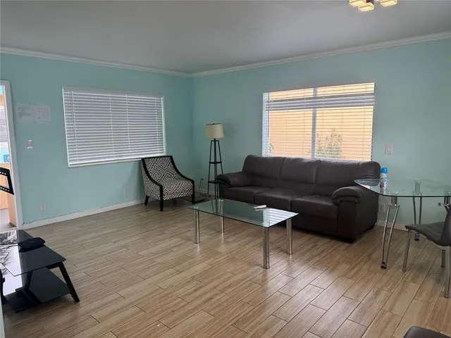 a living room with furniture and a window