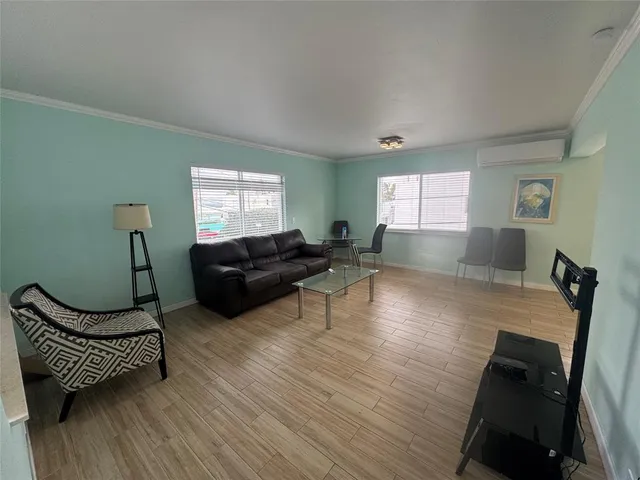 a living room with furniture and a window