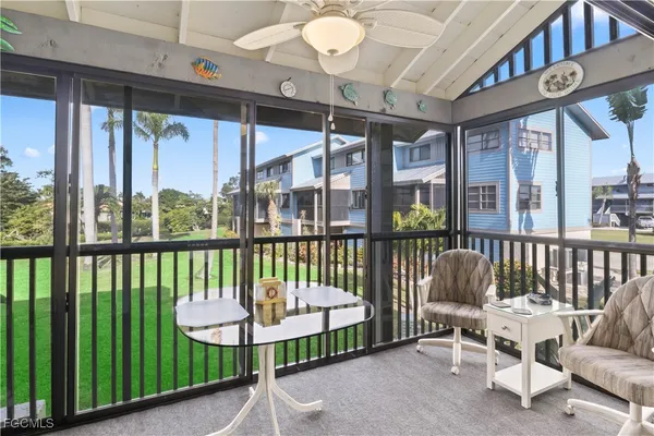 a view of a balcony with furniture
