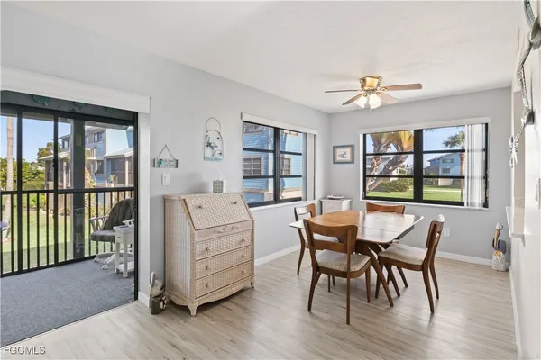 a dining room with furniture window wooden floor