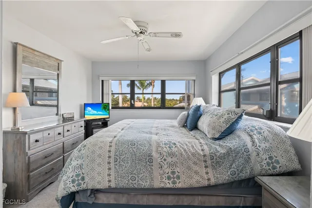 a bedroom with a large bed and a window